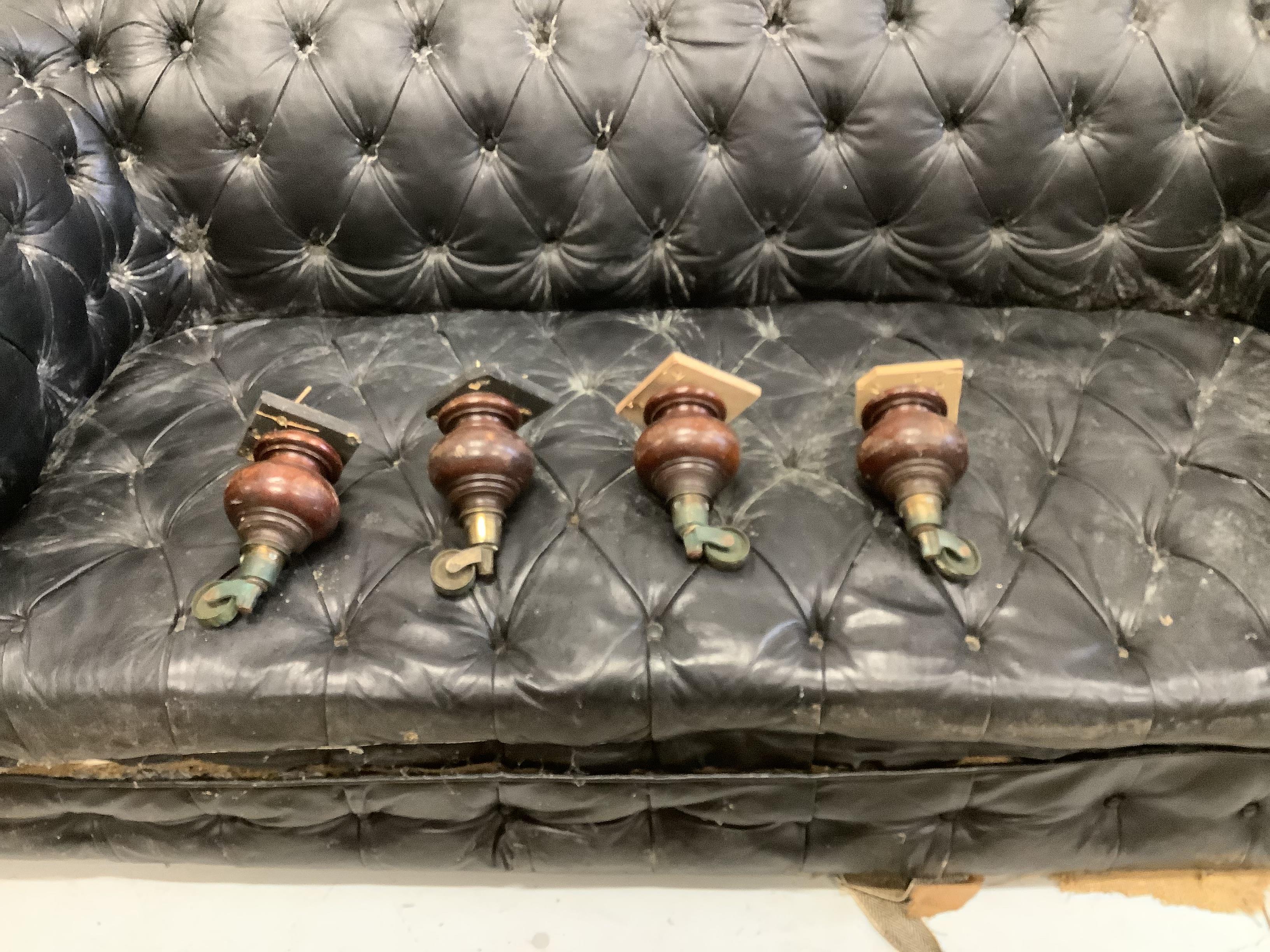 A Victorian and later buttonback leather Chesterfield settee, feet detached and in need of restoration, width 204cm, depth 99cm, height 66cm